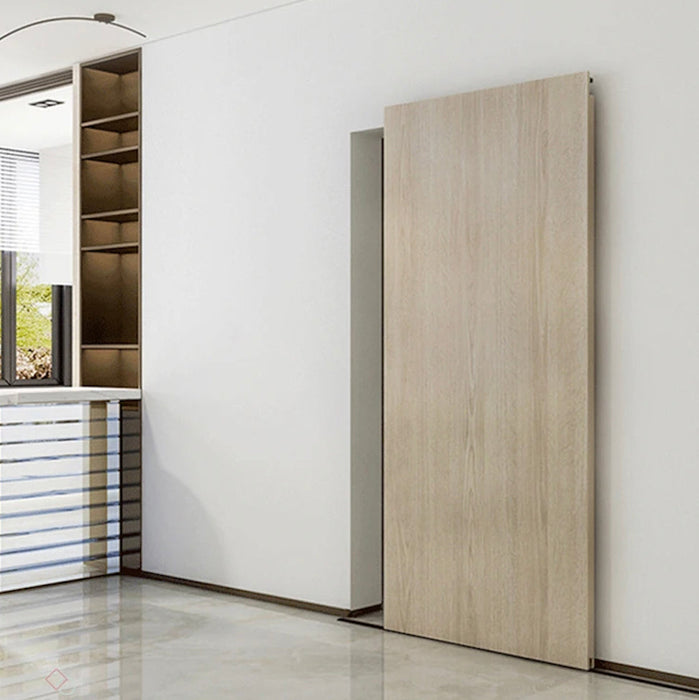 Modern interior with a sliding wooden door in a minimalistic room.