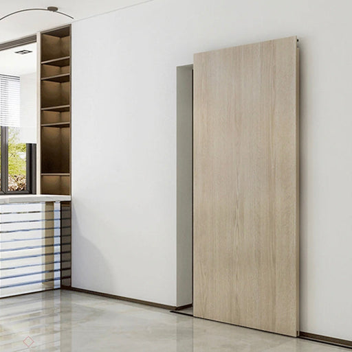 Modern interior with a sliding wooden door in a minimalistic room.