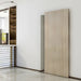Modern interior with a sliding wooden door in a minimalistic room.
